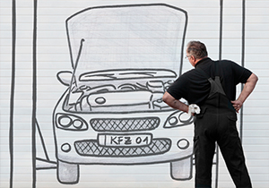 Montage von Fotografie und Zeichnung einer KFZ-Werkstatt